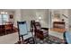 Cozy living room with rocking chairs, neutral tones and a view to the dining room at 237 Walnut Point Dr, Matthews, NC 28105