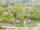 Expansive wooded lots as seen from an aerial view. The home has a long driveway and a detached garage at 2582 Ivey Church Rd, Lincolnton, NC 28092