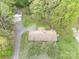 Aerial view of a single-Gathering home with a long driveway and garage nestled among mature trees at 2582 Ivey Church Rd, Lincolnton, NC 28092