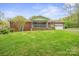 Expansive backyard featuring a screened porch and detached garage, perfect for outdoor living at 2582 Ivey Church Rd, Lincolnton, NC 28092