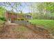 Brick home with a screened porch, showcasing a well-kept backyard and patio area at 2582 Ivey Church Rd, Lincolnton, NC 28092