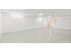 A clean unfinished basement is well-lit with a concrete floor and white-painted walls at 2582 Ivey Church Rd, Lincolnton, NC 28092