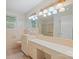Vintage bathroom with vanity, storage, and tile, plus a shower with glass door at 2582 Ivey Church Rd, Lincolnton, NC 28092