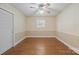 Bedroom with hardwood floors, neutral walls, and a ceiling fan at 2582 Ivey Church Rd, Lincolnton, NC 28092