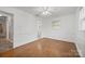 Bedroom with a view of the ensuite bathroom, natural light, and hardwood floors at 2582 Ivey Church Rd, Lincolnton, NC 28092