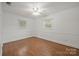 Bright, empty bedroom with hardwood floors, a ceiling fan, and ample natural light at 2582 Ivey Church Rd, Lincolnton, NC 28092