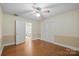 Bedroom features hardwood floors, and a closet with access to an ensuite bathroom at 2582 Ivey Church Rd, Lincolnton, NC 28092