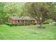 Charming brick home featuring meticulously maintained landscaping and a lush green lawn at 2582 Ivey Church Rd, Lincolnton, NC 28092