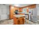 Functional kitchen with wood cabinetry, stainless steel appliances, and center island at 2582 Ivey Church Rd, Lincolnton, NC 28092
