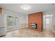 Bright living room featuring a brick fireplace and access to a screened-in porch at 2582 Ivey Church Rd, Lincolnton, NC 28092