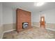 Inviting living room showcasing a classic brick fireplace and neutral decor at 2582 Ivey Church Rd, Lincolnton, NC 28092