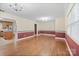 Open living room showcasing hardwood floors, large windows, and seamless flow into the kitchen at 2582 Ivey Church Rd, Lincolnton, NC 28092
