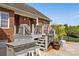 Outdoor deck featuring a built-in bar, seating, and stairs leading to a backyard retreat perfect for entertaining at 2610 Flagstone Ct, Shelby, NC 28152