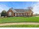 Charming brick home with a well-manicured lawn and a welcoming front porch at 2610 Flagstone Ct, Shelby, NC 28152