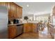 Spacious kitchen with wood cabinets, hardwood floors, stainless steel appliances, and seamless flow to dining at 2610 Flagstone Ct, Shelby, NC 28152