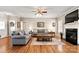 Cozy living room featuring hardwood floors, a fireplace, and comfortable seating for a relaxing atmosphere at 2610 Flagstone Ct, Shelby, NC 28152