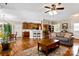 Inviting living room featuring hardwood floors, comfortable seating, and seamless flow to the kitchen at 2610 Flagstone Ct, Shelby, NC 28152
