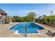 Sparkling in-ground pool surrounded by a secure fence, set against a backdrop of mature trees and manicured lawns at 2610 Flagstone Ct, Shelby, NC 28152