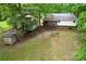 A charming home with a spacious yard and a cozy enclosed back porch and a utility shed at 2929 Matoka Trl, Matthews, NC 28104