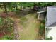 An aerial view of the backyard with a lawn and surrounding trees at 2929 Matoka Trl, Matthews, NC 28104