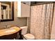 Bathroom featuring a vanity with a marble countertop, toilet, and shower with patterned curtain at 2929 Matoka Trl, Matthews, NC 28104