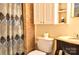 Cozy bathroom with tiled walls, vanity with granite countertop, and decorative shower curtain at 2929 Matoka Trl, Matthews, NC 28104