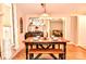 Traditional dining room featuring a wooden table with bench seating and decorative elements at 2929 Matoka Trl, Matthews, NC 28104
