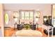 Bright and airy living room with hardwood floors and a comfortable loveseat at 2929 Matoka Trl, Matthews, NC 28104