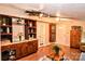 Living room showcasing a built-in shelving unit with cabinets, stylish decor and wood-style flooring at 2929 Matoka Trl, Matthews, NC 28104