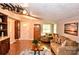 Cozy living room featuring unique decorations, hardwood floors, and plenty of natural light at 2929 Matoka Trl, Matthews, NC 28104