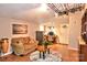 Cozy living room featuring a comfortable couch, wood floors and a unique coffee table on a round rug at 2929 Matoka Trl, Matthews, NC 28104
