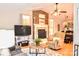 Cozy living room featuring a brick fireplace, hardwood floors, and comfortable seating arrangement at 2929 Matoka Trl, Matthews, NC 28104