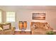 Cozy living room with comfortable seating, hardwood floors, and ample natural light at 2929 Matoka Trl, Matthews, NC 28104