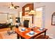 Hardwood floors, a brick fireplace, and the dining area give this open living room a spacious feel at 2929 Matoka Trl, Matthews, NC 28104