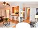 Open-concept living area with hardwood floors, kitchen bar, and a seamless flow to the rest of the home at 2929 Matoka Trl, Matthews, NC 28104