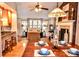 Open concept living space featuring a dining table, kitchen, and living room with fireplace at 2929 Matoka Trl, Matthews, NC 28104