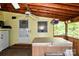 Relaxing screened porch with a hot tub and views of the surrounding greenery at 2929 Matoka Trl, Matthews, NC 28104