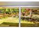 Covered porch providing a serene view of the landscaped yard and surrounding greenery at 2929 Matoka Trl, Matthews, NC 28104