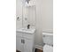 Modern bathroom featuring a white vanity with quartz countertops, undermount sink, black hardware, and updated fixtures at 3012 Isle Ln, Monroe, NC 28110