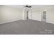 Neutral bedroom featuring a ceiling fan, gray carpet, and plenty of space at 3012 Isle Ln, Monroe, NC 28110
