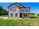 Charming home featuring vertical siding, black trim, and a well-manicured lawn in a serene setting at 3012 Isle Ln, Monroe, NC 28110