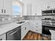 Well-lit kitchen featuring sleek appliances, white cabinets, and a stylish backsplash for a modern look at 3012 Isle Ln, Monroe, NC 28110