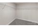 Empty walk-in closet with wire shelving and neutral carpeting at 3012 Isle Ln, Monroe, NC 28110