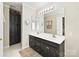 Spacious bathroom featuring a double sink vanity with modern fixtures and ample storage at 3017 Planters Walk Ct, Charlotte, NC 28210