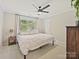 Calm bedroom has a large window and soft lighting at 3017 Planters Walk Ct, Charlotte, NC 28210