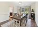 Dining room with a view to the backyard and stainless steel bar at 3017 Planters Walk Ct, Charlotte, NC 28210