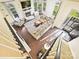 Bright living room with hardwood floors, large windows, and a cozy fireplace creates a welcoming ambiance at 3017 Planters Walk Ct, Charlotte, NC 28210