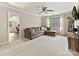 Cozy living room with plush carpeting, comfortable seating, and a well-lit adjacent room for an office at 3017 Planters Walk Ct, Charlotte, NC 28210