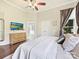 Comfortable main bedroom with a ceiling fan, hardwood floors, and an ensuite bathroom at 3017 Planters Walk Ct, Charlotte, NC 28210