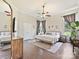 Comfortable main bedroom with a ceiling fan, hardwood floors, and natural light from the exterior at 3017 Planters Walk Ct, Charlotte, NC 28210